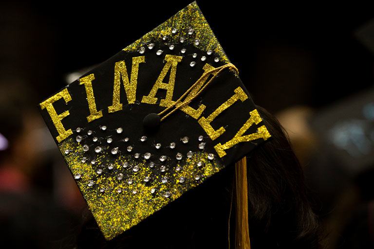 a photo of a graduate's mortarboard that says "finally"