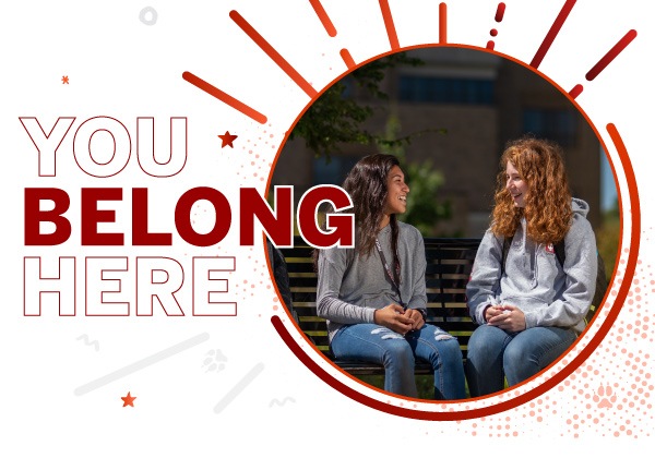 a photo of two Indiana University East students conversing with the words "you belong here" superimposed on it.