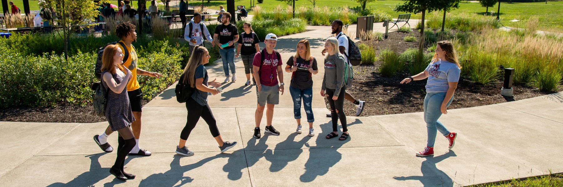 Students gathering, socializing, and crossing paths with other IU East students.